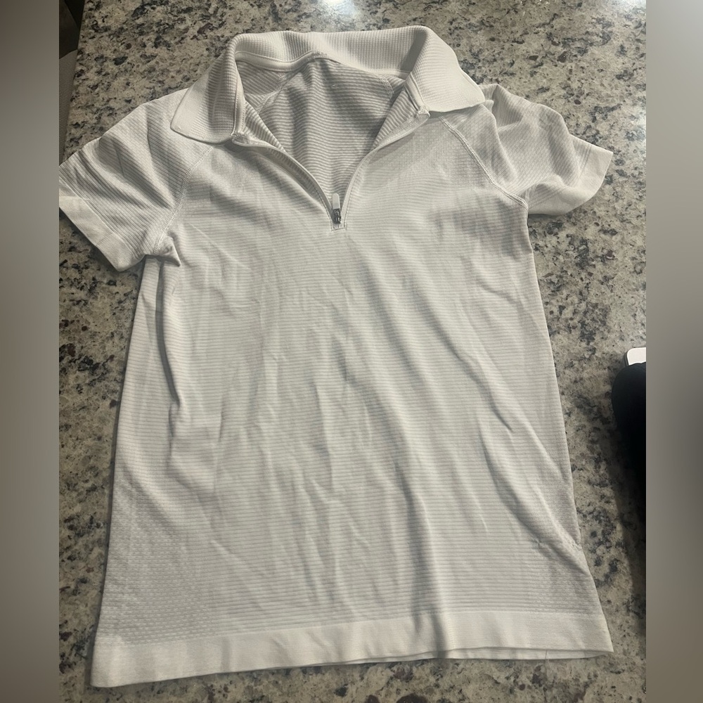 white golf LULULEMON top.